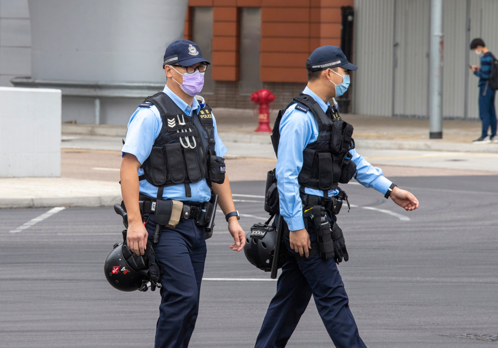 Two Hong Kong police officers wearing face masks